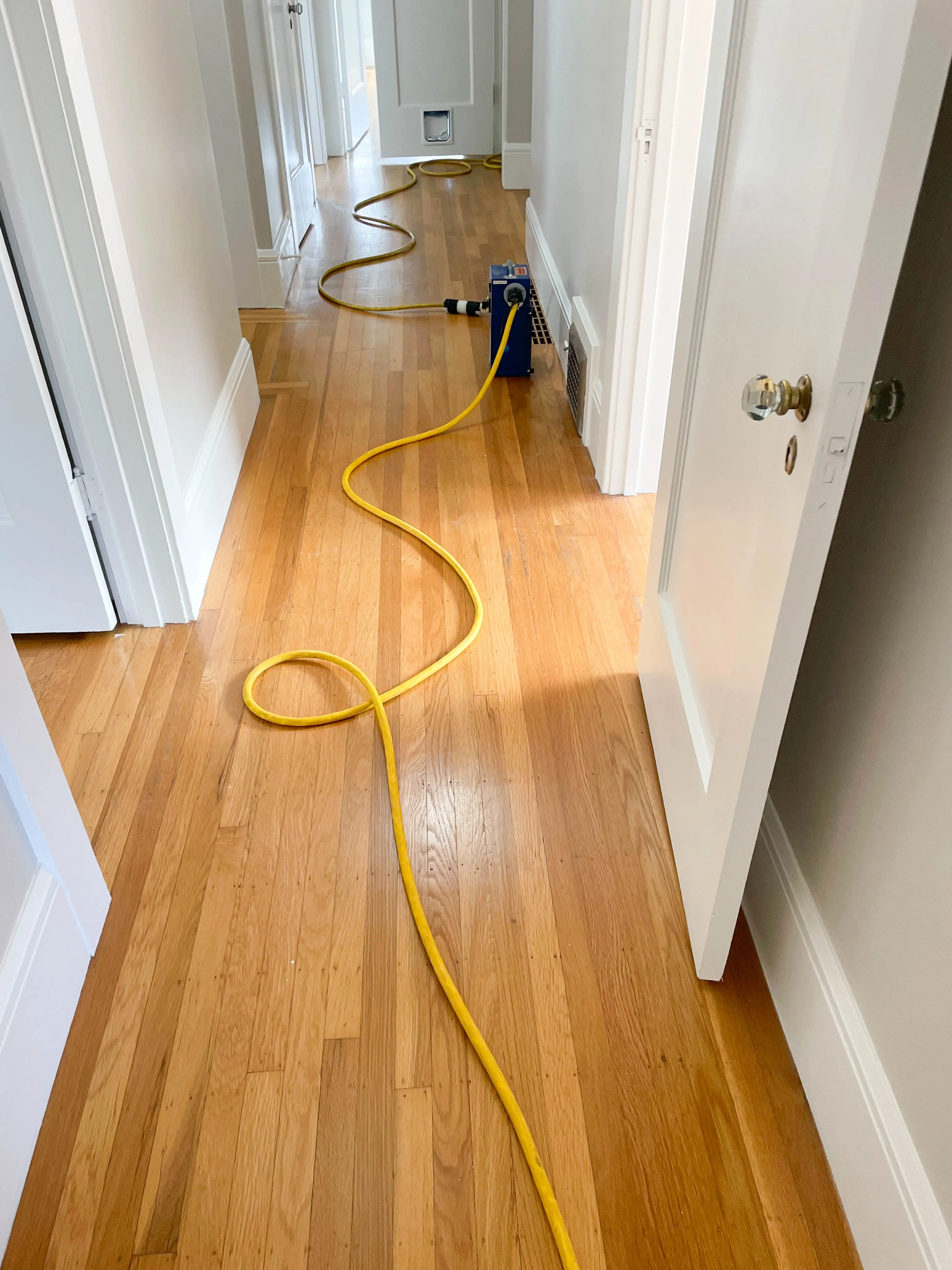 Picture of A hardwood floor before sanding - Alva Flooring Inc.