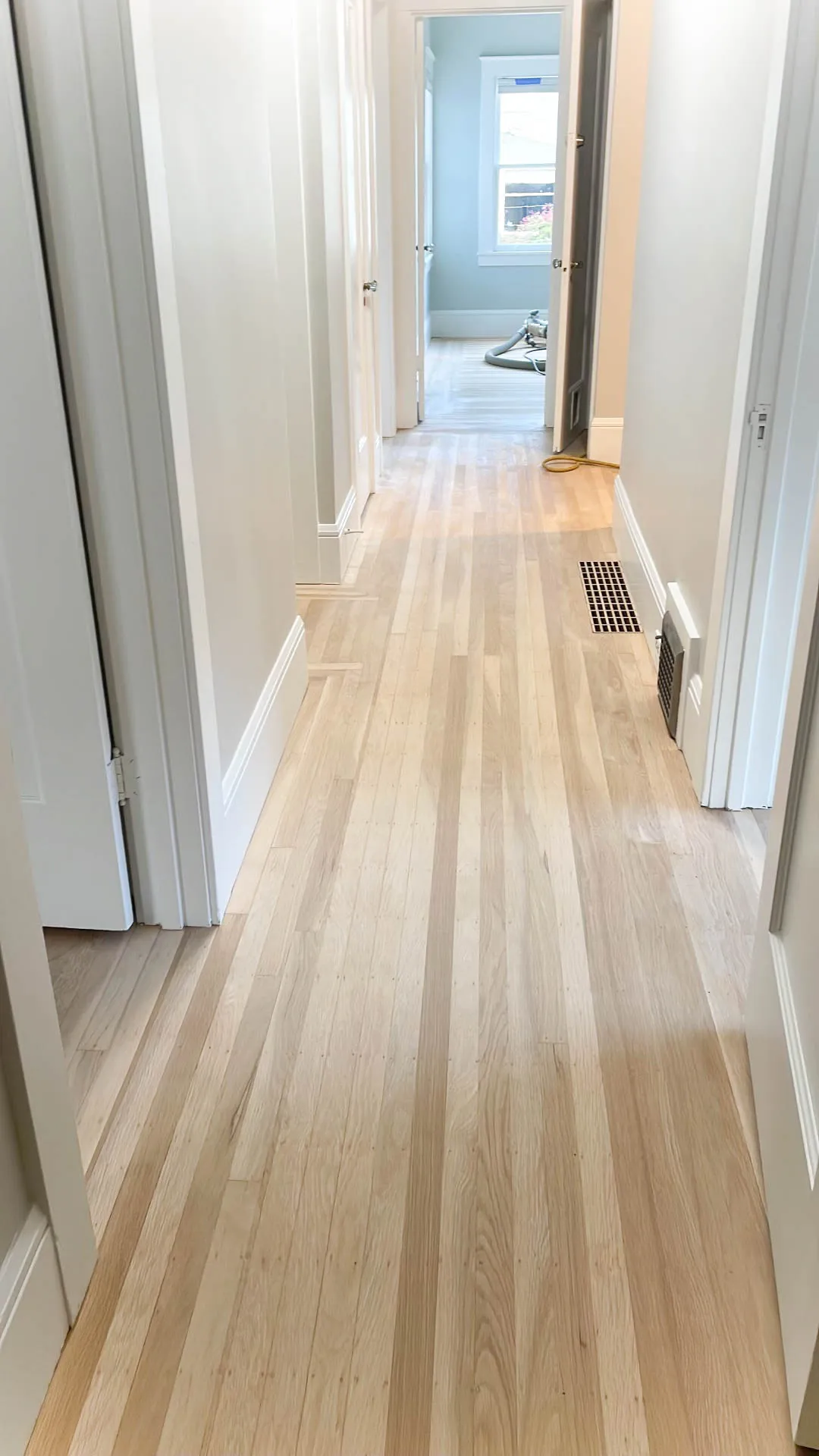 Picture of A hardwood floor after sanding and before staining - Alva Flooring Inc.