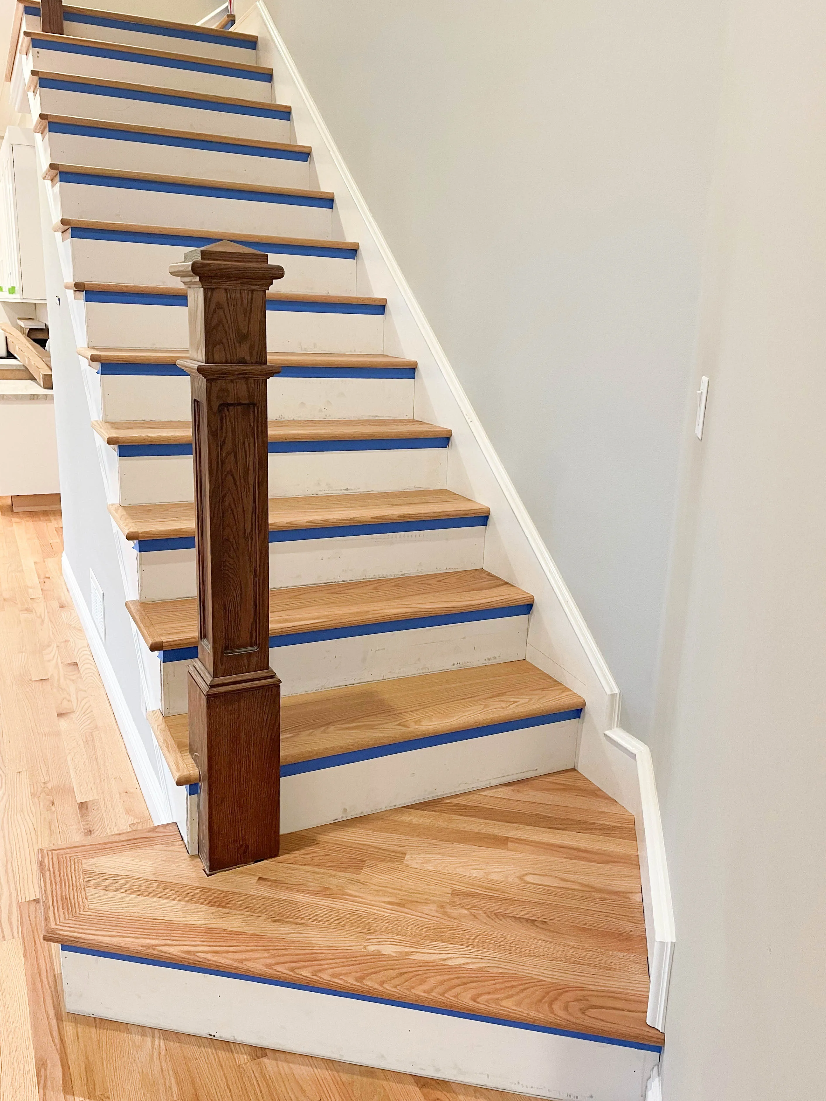 Picture of These red oak steps were finished with natural sealer and three coats of commercial-grade finish with a satin water base. - Alva Flooring Inc.