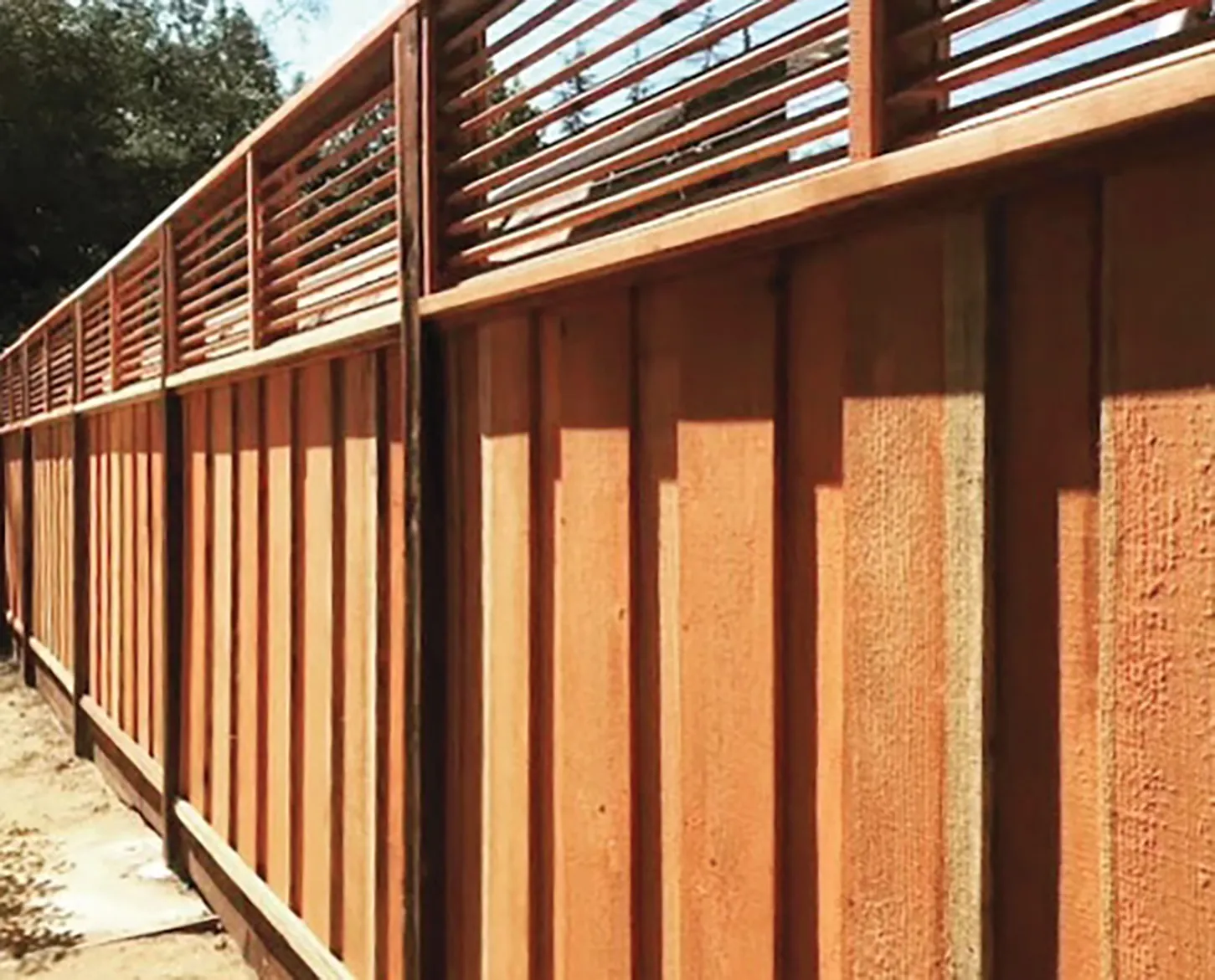 Picture of Guy's Fencing’s signature product is a board-on-board fence with custom louvers. - Guy's Fencing, Inc.