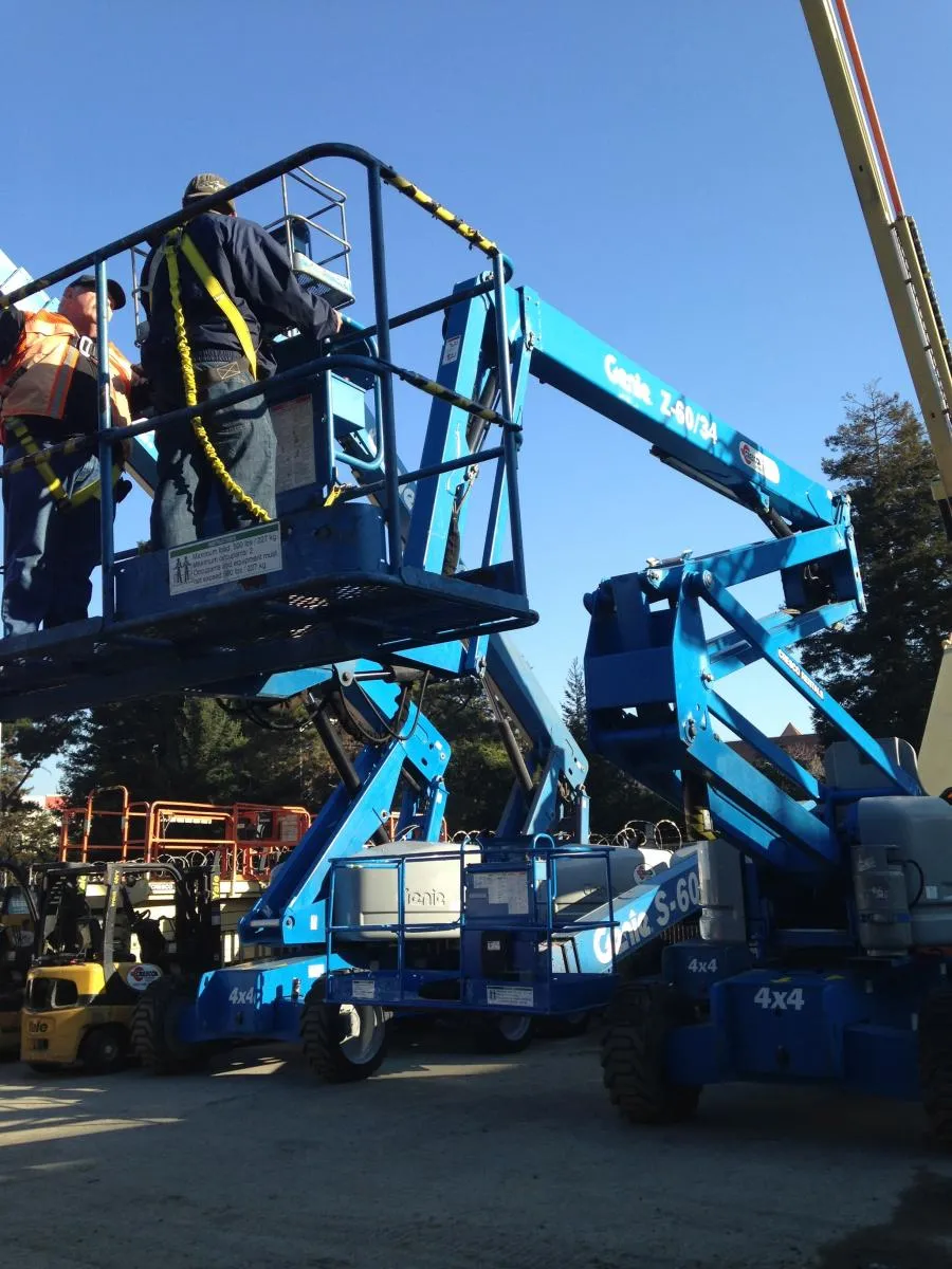 Picture of AWC technician Adrian learns how to maneuver a lift at the Cresco lift certification program. - AWC