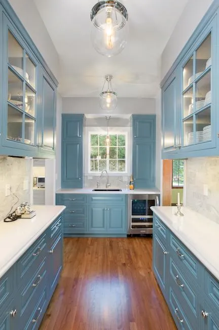 Picture of RECO installed LED lights and dramatic fixtures to showcase the hardwood floors in this kitchen. - Roberts Electric Company, Inc.