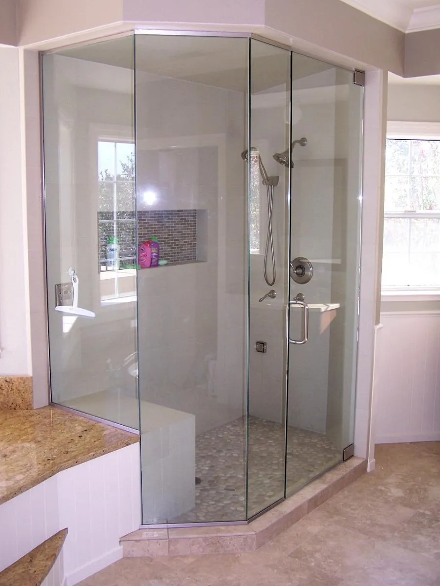 Picture of Custom 1/2" glass shower with textile shower wall tile travertine floor. - Labourdette Construction