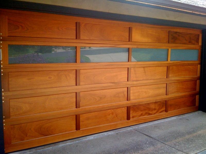 Picture of An all-mahogany, stile and rail painted garage door with white laminate glass in Lafayette - Madden Door & Sons, Inc.