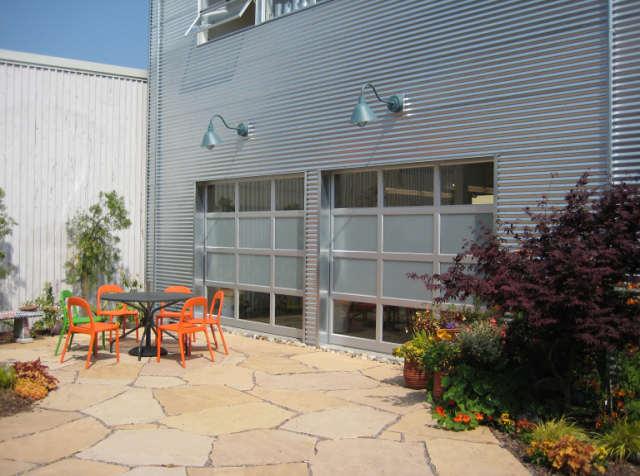 Picture of Raynor StyleView aluminum/mixed glass garage doors at a Berkeley art studio - Madden Door & Sons, Inc.