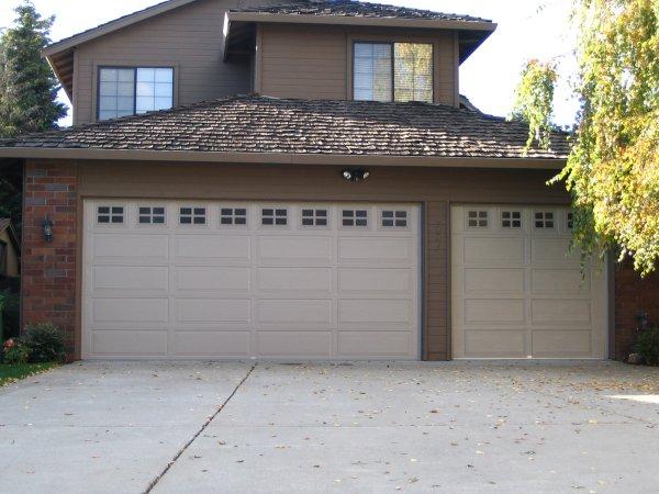 Picture of A Raynor mixed panel garage door with windows in Oakland Hills - Madden Door & Sons, Inc.