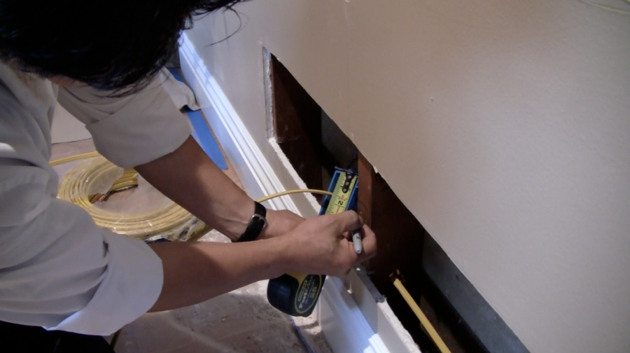 Picture of An Aren Electric Co. technician works on a residential wiring project. - Aren Electric Co., Inc.