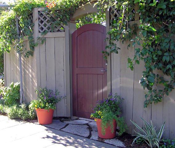 Picture of Dinwoodie Landscape Services installed stones and pots to make this back entry look more inviting. - Dinwoodie Landscape Services