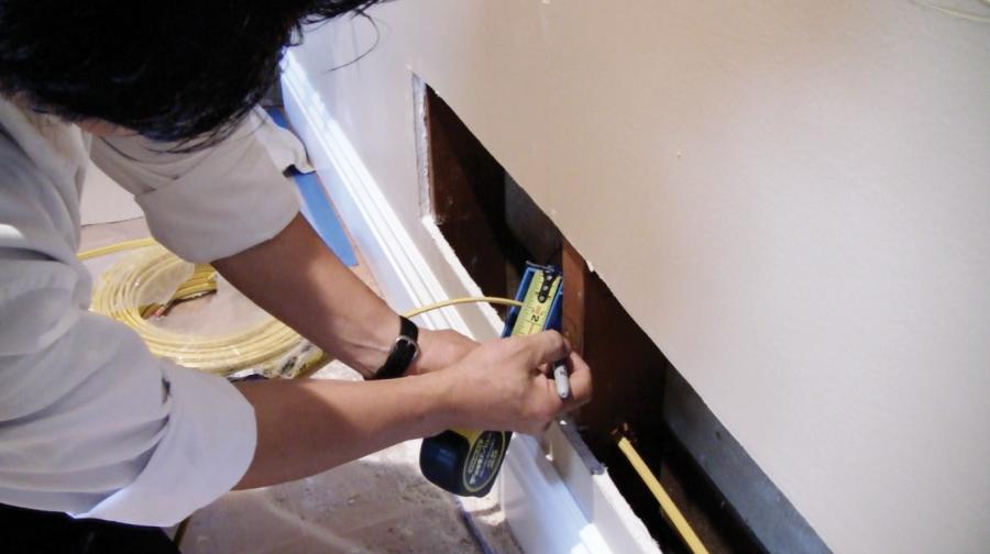 Picture of An Aren Electric Co. technician works on a residential wiring project. - Aren Electric Co., Inc.