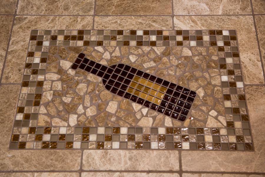 Picture of This mosaic design is featured in a client’s wine cellar. - Derrick Tracey Custom Tile & Marble