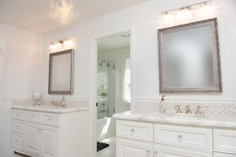 Picture of This “Jack and Jill” bathroom in Pleasanton features marble slab countertops and mosaic backsplash. - Derrick Tracey Custom Tile & Marble