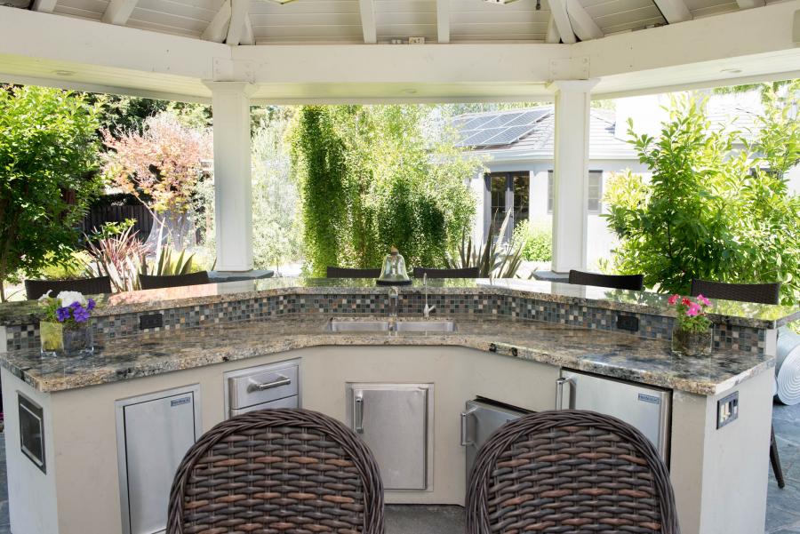 Picture of This outdoor kitchen in San Ramon features granite slab and is accented with mosaic backsplash. - Derrick Tracey Custom Tile & Marble