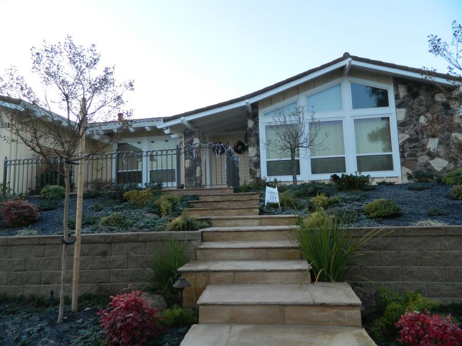 Picture of Devengenzo Landscaping & General Engineering installed flagstone steps in a staggered pattern to accent the home's entryway. - Devengenzo Landscaping & General Engineering Inc.