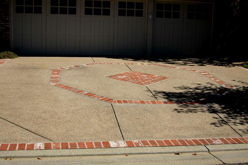 Picture of An exposed aggregate driveway with brick inlay in Walnut Creek - Dana Lund Landscaping, LLC