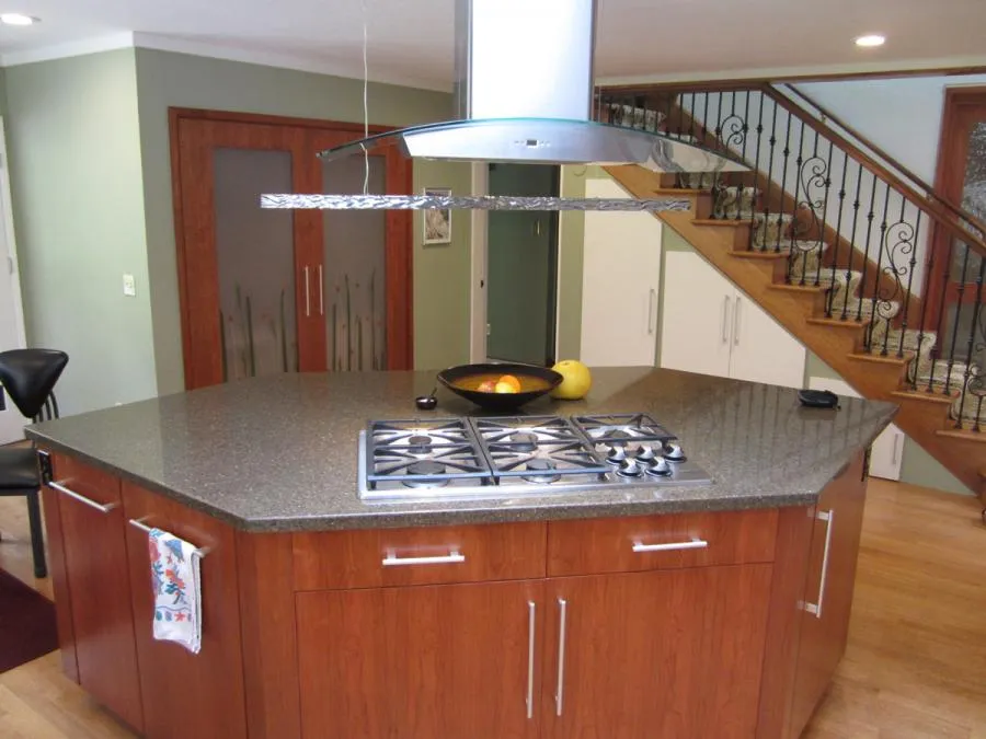 Picture of This hexagonal kitchen island helps connect the kitchen to adjacent areas. - Century Cabinets