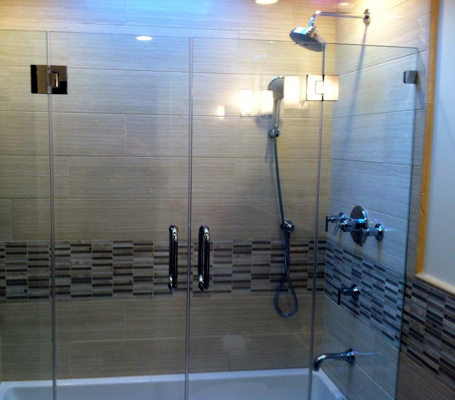 Picture of Derrick Tracey Custom Tile & Marble installed 12×24 tiles and mosaic liner accents in this shower. - Derrick Tracey Custom Tile & Marble