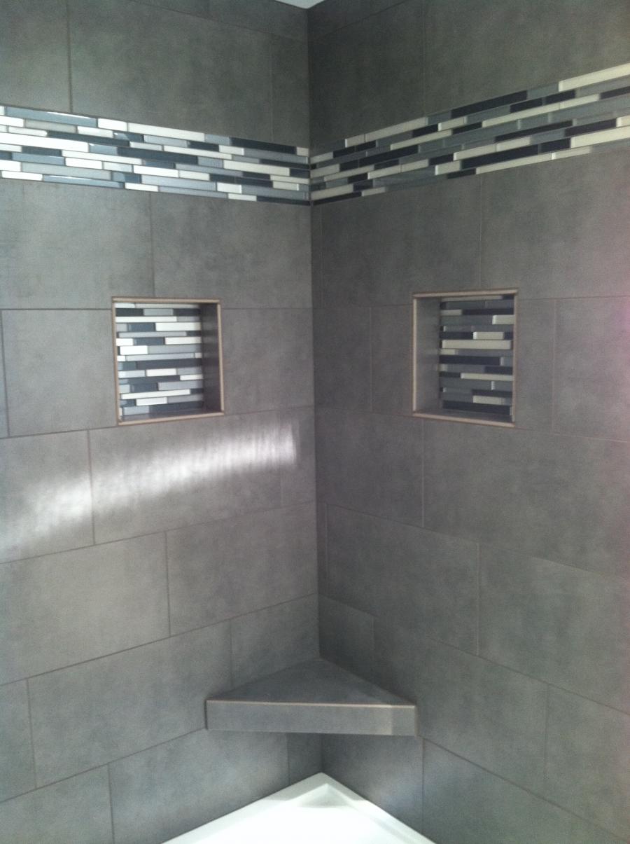 Picture of This shower features a 12×24 glass mosaic tile design. - Derrick Tracey Custom Tile & Marble