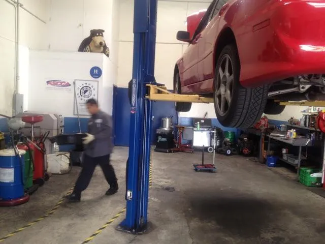 Picture of The yellow and black stripes on Acur-it Auto Repair's shop floor lead to clean restrooms. - Acur-it Auto Repair