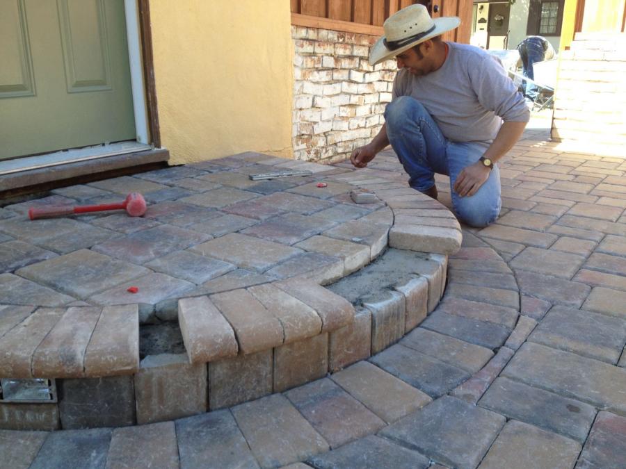 Picture of A Modern Paving technician works on a customerÛªs paving stone project. - Modern Paving, Inc. - Peninsula