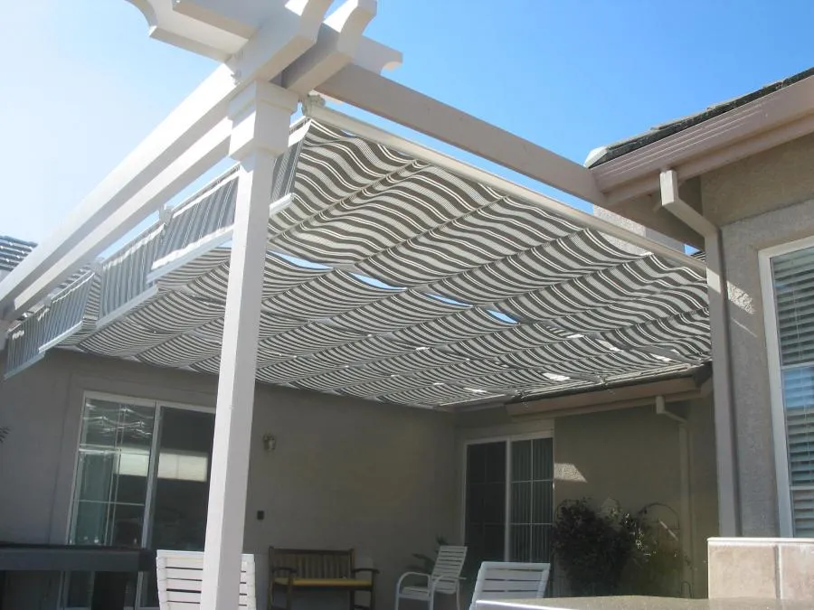 Picture of Acme Sunshades Enterprise installed this pergola with Roman shades on a customer's back patio. - Acme Sunshades Enterprise Inc.