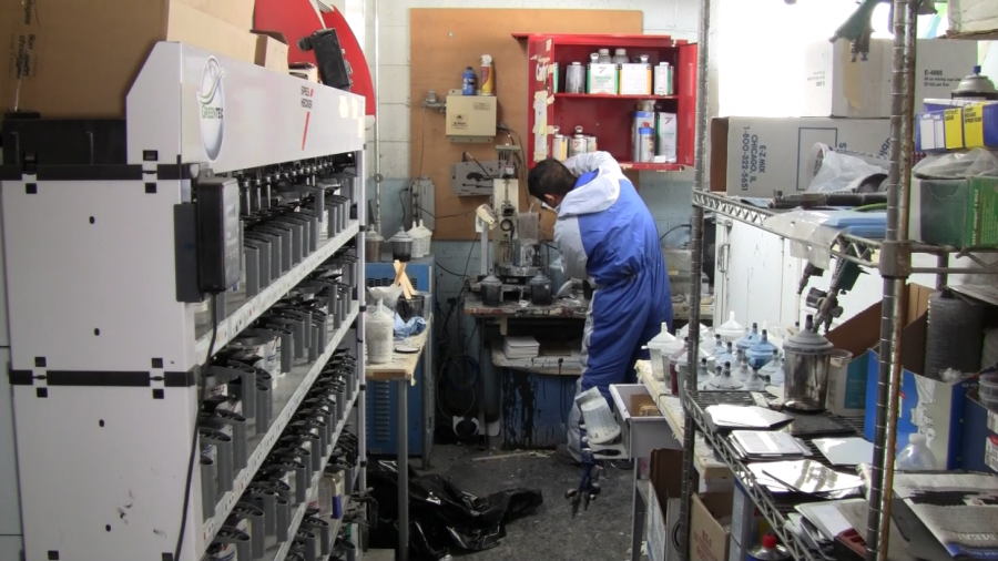 Picture of A Proline Auto Body Services technician mixes paint. - Proline Auto Body Services, Inc.