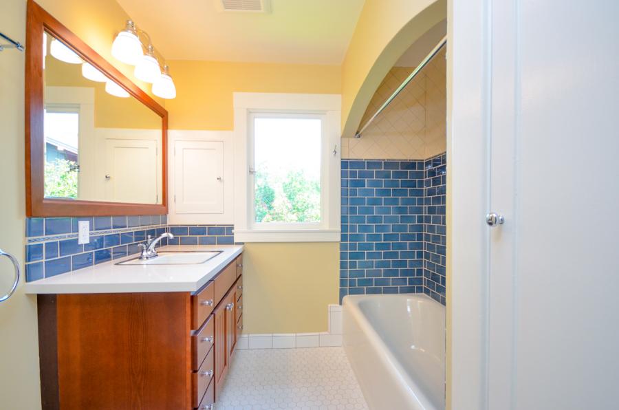 Picture of This bathroom remodeling project features tilework a bathtub lighting plumbing and additional closet space. - Home Healing Renovations, Inc.