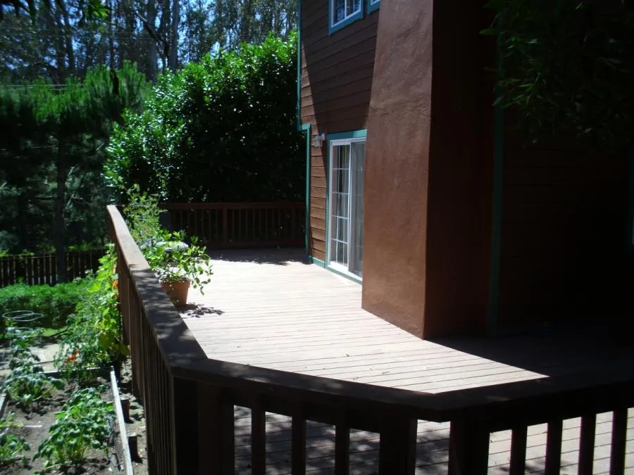 Picture of This remodeling project features French doors that open from the kitchen to a wrap-around deck. - Thomas A Daly Construction