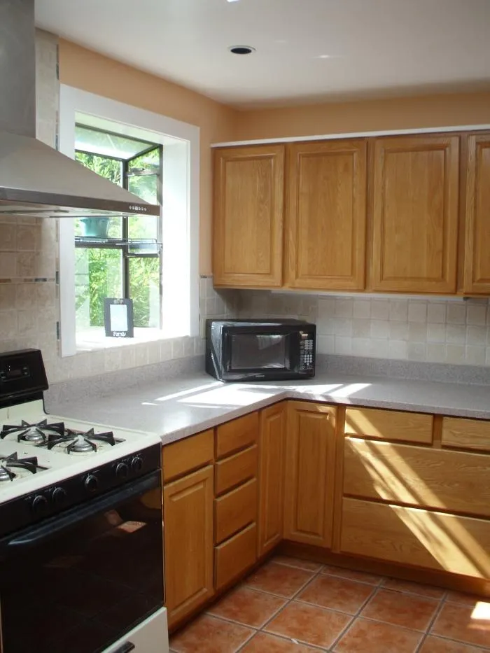 Picture of Thomas A Daly Construction installed oak cabinets granite countertops and a large skylight in this Mill Valley kitchen. - Thomas A Daly Construction