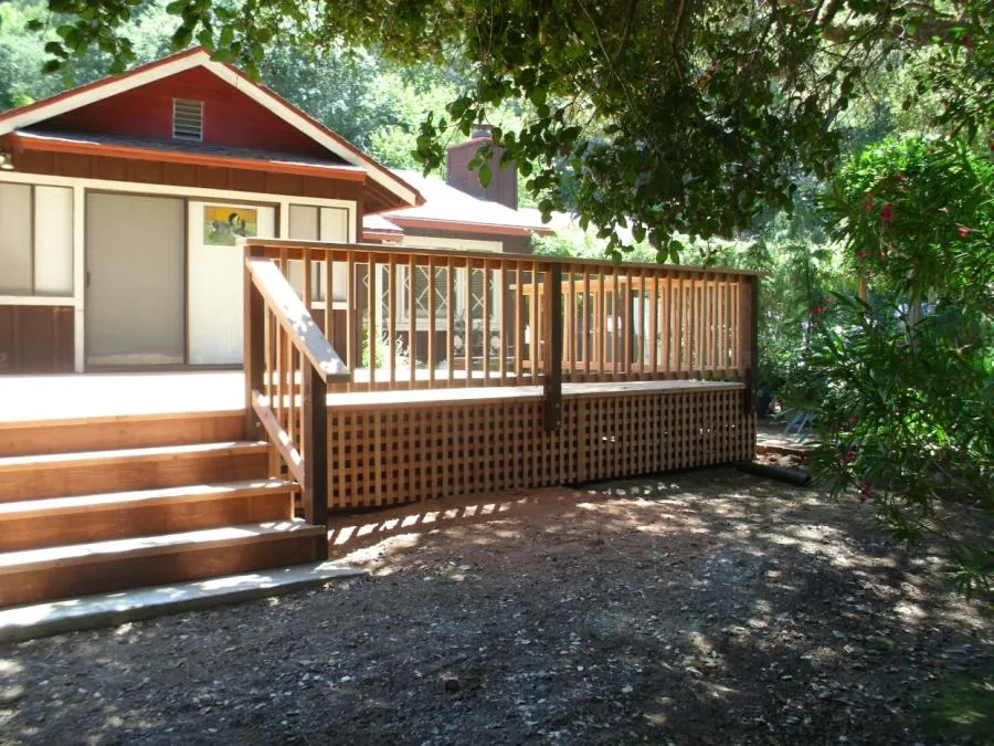 Picture of Deck and stair railings complete this redwood deck project. - Thomas A Daly Construction