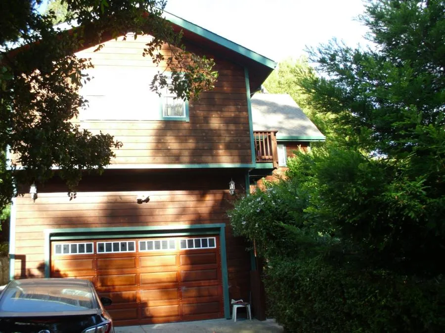 Picture of Thomas A Daly Construction built a 400-square-foot master suite with a balcony over this garage. - Thomas A Daly Construction