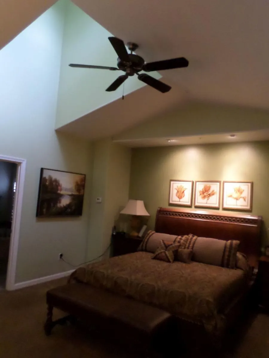 Picture of Thompson Construction used a dormer window to create a skylight effect in this bedroom. - Thompson Construction, Inc.