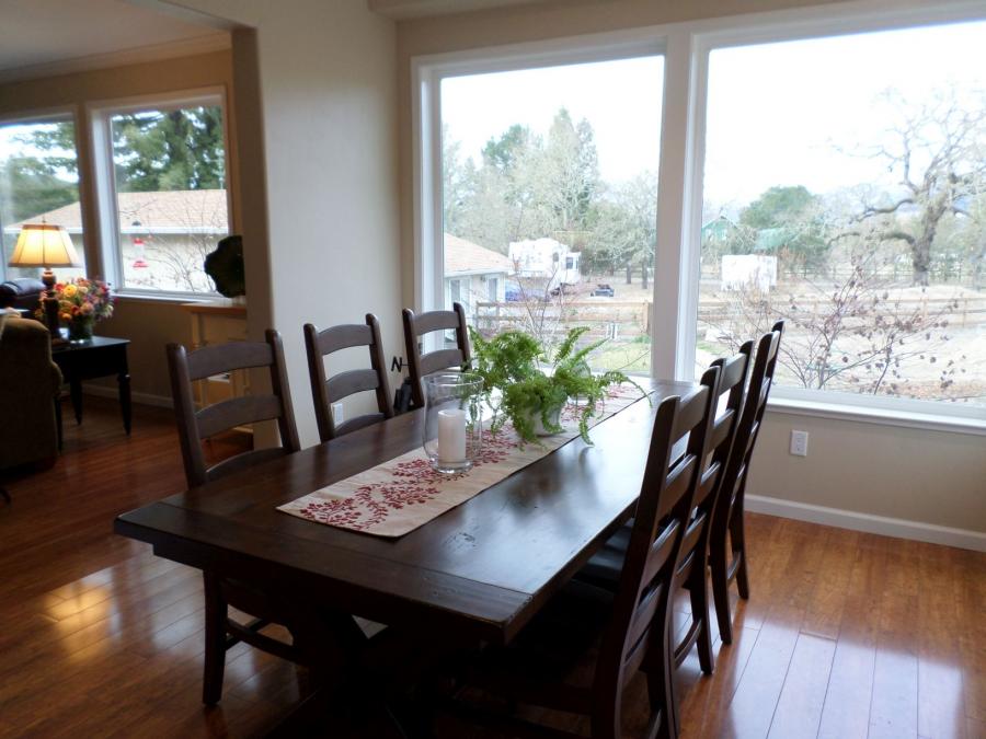 Picture of Thompson Construction installed this cherry hardwood floor without a seam which allowed for a smooth flow from room to room. - Thompson Construction, Inc.