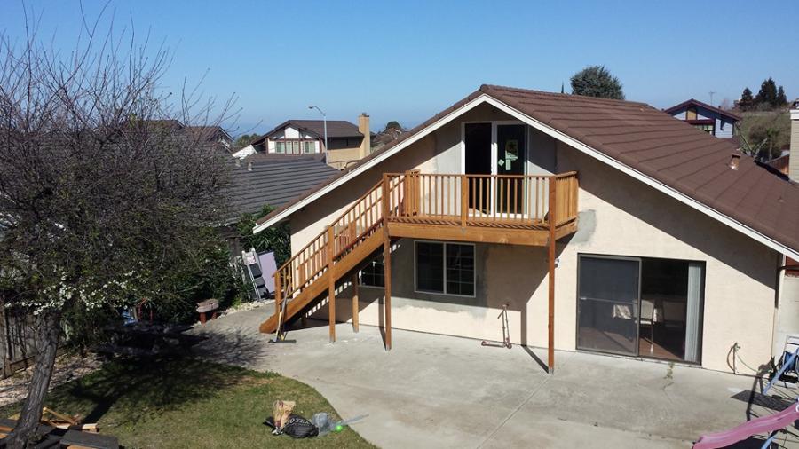 Picture of Willow Creek Construction converted this attic into an office and added a deck with stairs. - Willow Creek Construction