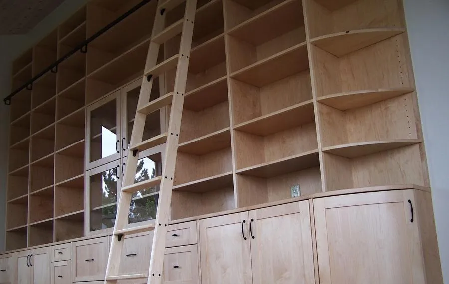 Picture of Maple library with custom ladder and curved end cabinet. - Labourdette Construction