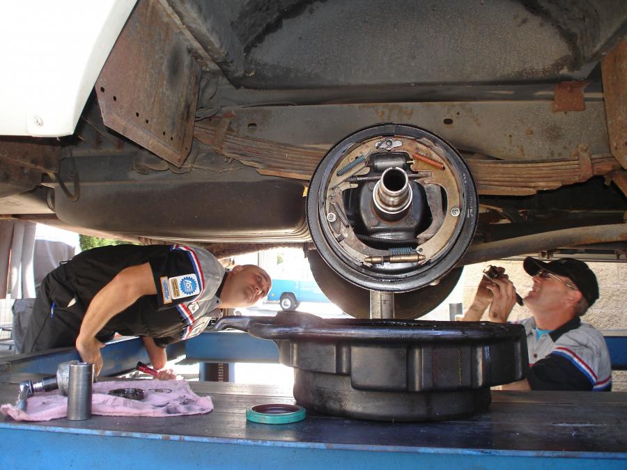 Picture of Ryan Devonshire (L) and a technician inspect a customerÛªs vehicle. - Ernie's Service Center