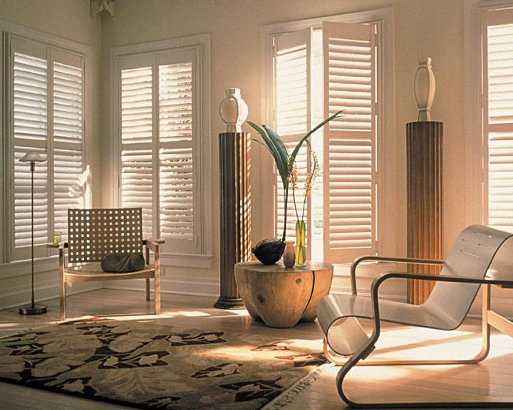 Picture of This room features Palm Beach shutters, wood floors and an area rug. - PKS Interiors