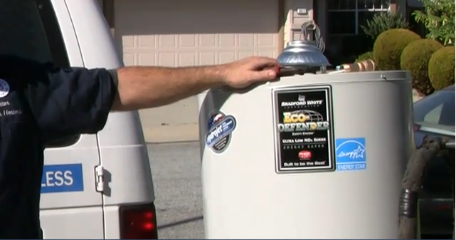 Picture of Owner Frans Cartwright stands in front of one of Better Water Heaters' service vans. - Better Water Heaters, Inc.