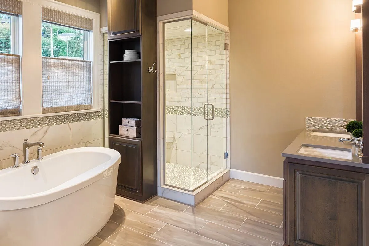 Picture of Schicker Luxury Shower Doors installed this frameless shower door to give the appearance of a larger bathroom. - Schicker Luxury Shower Doors, Inc.