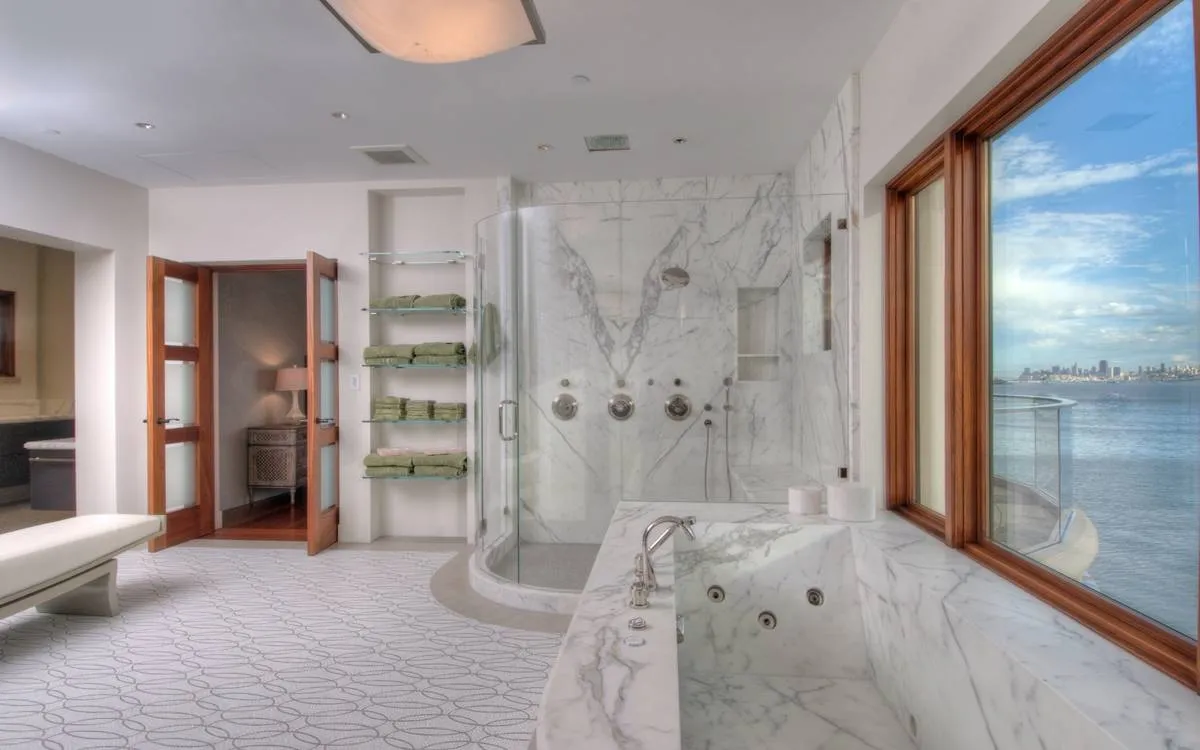 Picture of Schicker Luxury Shower Doors worked on this marble bathroom in a home in Emeryville that overlooks San Francisco. - Schicker Luxury Shower Doors, Inc.