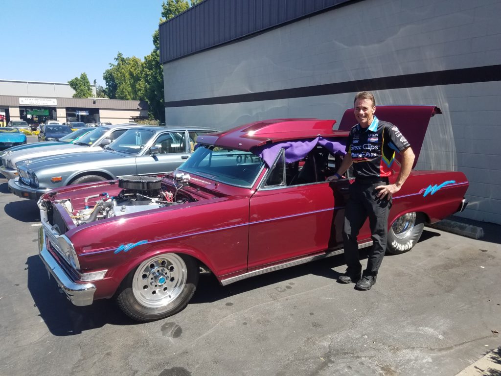 Picture of NHRA Top Fuel drag racing star Clay Millican recently paid a visit to ASAP Automotive’s shop. - ASAP Automotive, Inc.