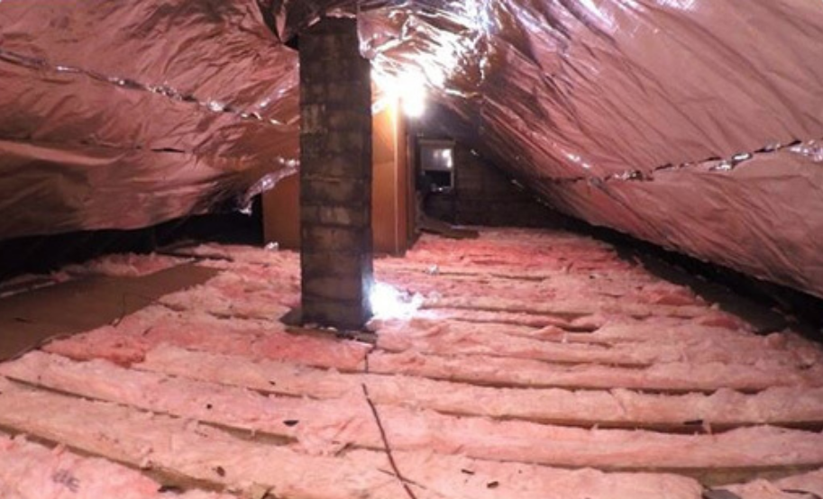 Picture of (2 of 2) Atticare removed and replaced the damaged insulation blocked all rodent entry points and installed a radiant barrier to improve energy efficiency. - Atticare Construction