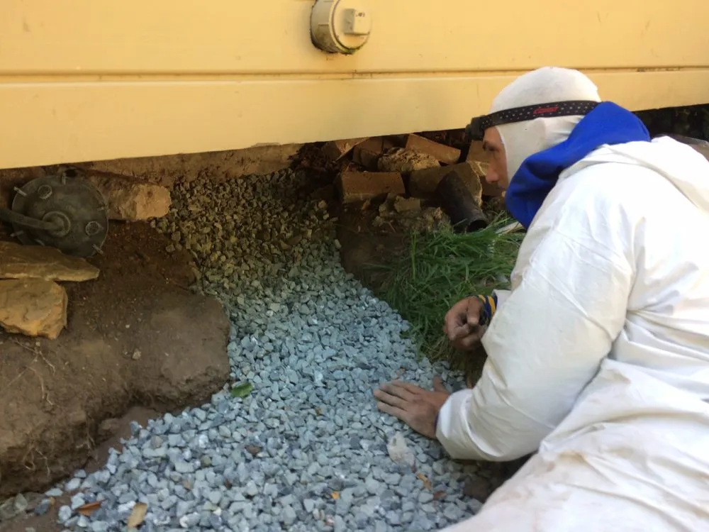 Picture of An Alley Cat technician prepares to work on a client's home. - Alley Cat