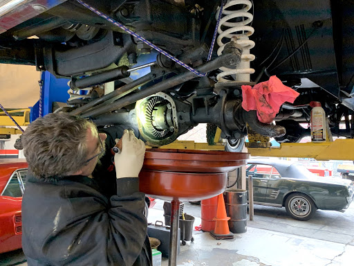 Picture of An Orinda Motors technician works on a customer’s classic vehicle. - Orinda Motors, Inc.