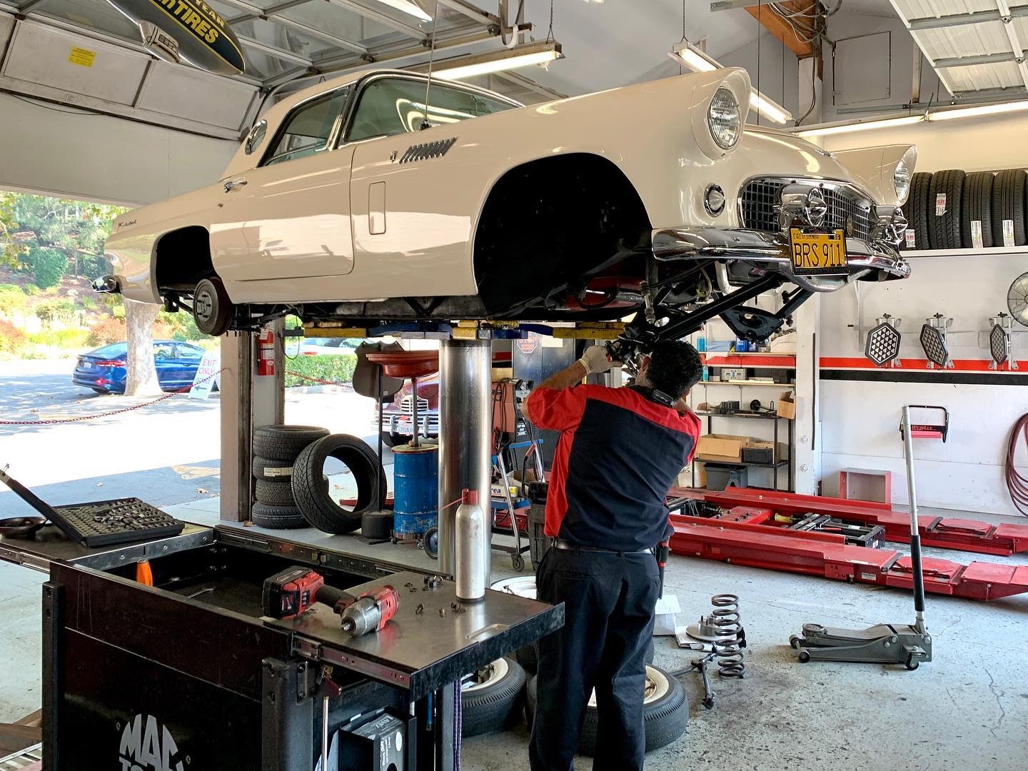 Picture of An Orinda Motors technician works on a customer’s vehicle. - Orinda Motors, Inc.