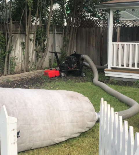 Picture of Johnson’s Insulation uses this machine to remove insulation from clients’ homes. - Johnson's Insulation