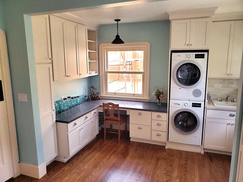 Picture of This office space and laundry area features a new rinse sink next to the back door. The desk cabinetry matches the kitchen but has a unique solid wood top. The stacking washer/dryer saves space. The a - Cook's Kitchen & Bath, Inc.