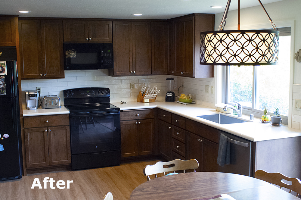 Picture of This walnut cabinetry from Custom Wood Products has a rich hazelnut stain color. The Caesarstone countertop is a lovely contrast along with the dramatic 3-inch by 12-inch subway-style backsplash from  - Cook's Kitchen & Bath, Inc.