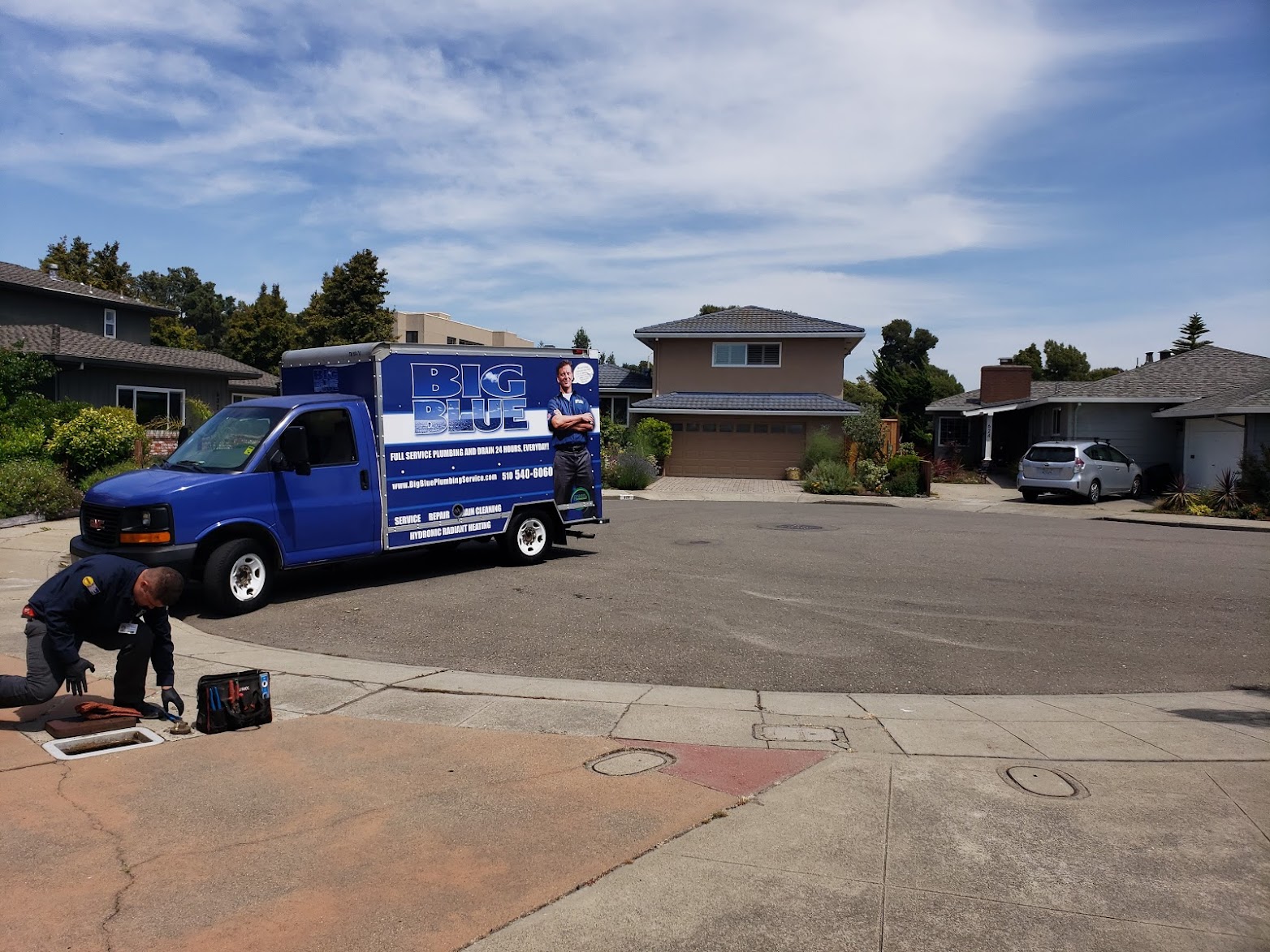 Picture of A Big Blue Plumbing technician performs a drain cleaning procedure. - Big Blue Plumbing