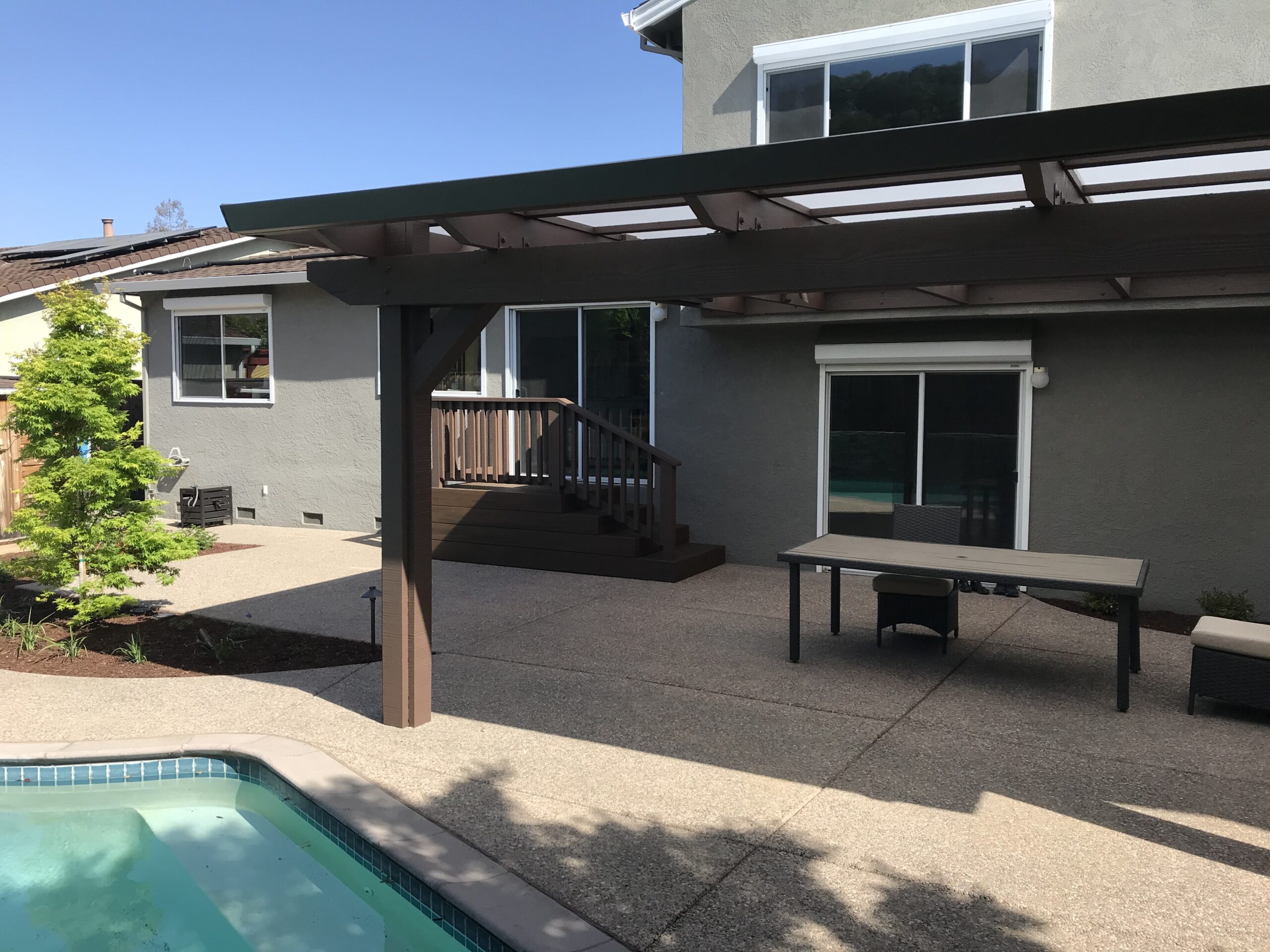 Picture of AFTER: Koch & Associates installed a new structure with a Polygal roof to protect the yard from both sunlight and rain. - Koch & Associates, Inc.