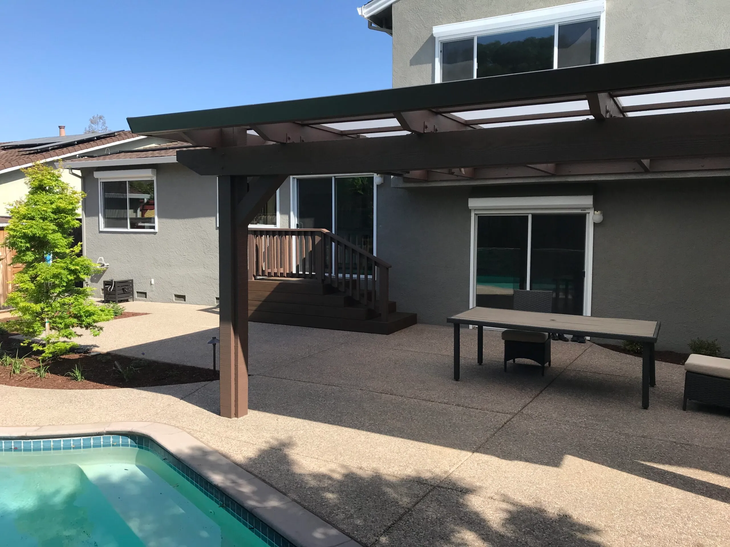 Picture of AFTER: Koch & Associates installed a new structure with a Polygal roof to protect the yard from both sunlight and rain. - Koch & Associates, Inc.